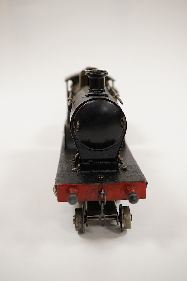 An 0 gauge live steam spirit fired tinplate GWR 4-4-0 tender locomotive, possibly Bing for Bassett-Lowke, 3411, with original fuel tank and burner, two controls in the cab and four wheel tender